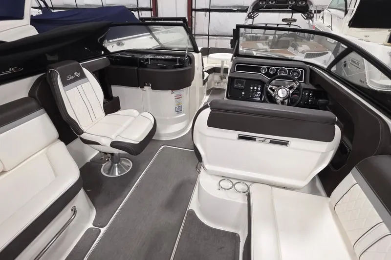 Slide: The Image of 2017 Sea Ray SLX 280 boat interior with luxurious seating and modern dashboard. - 5