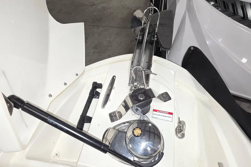 Slide: The Image of 2017 Sea Ray SLX 280 boat anchor system with safety warning label. - 7