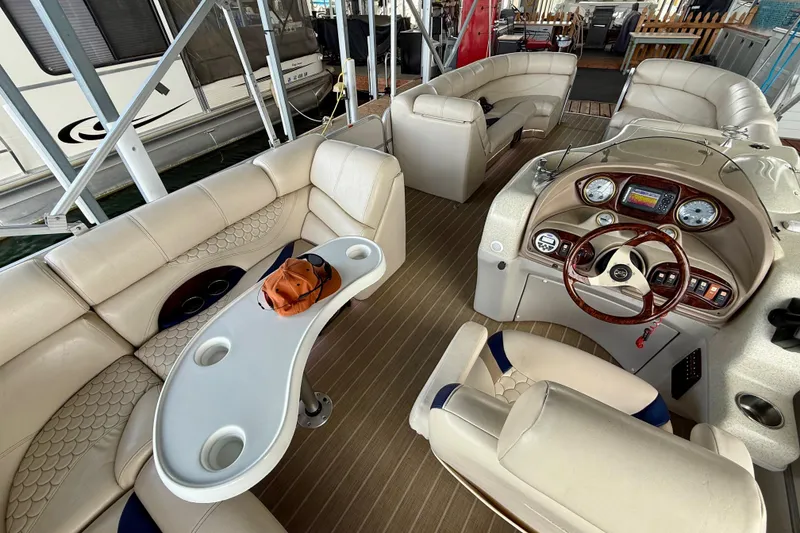 Slide: The Image of Luxurious interior of a 2007 South Bay 925CR TT I/O pontoon boat with plush seating. - 10