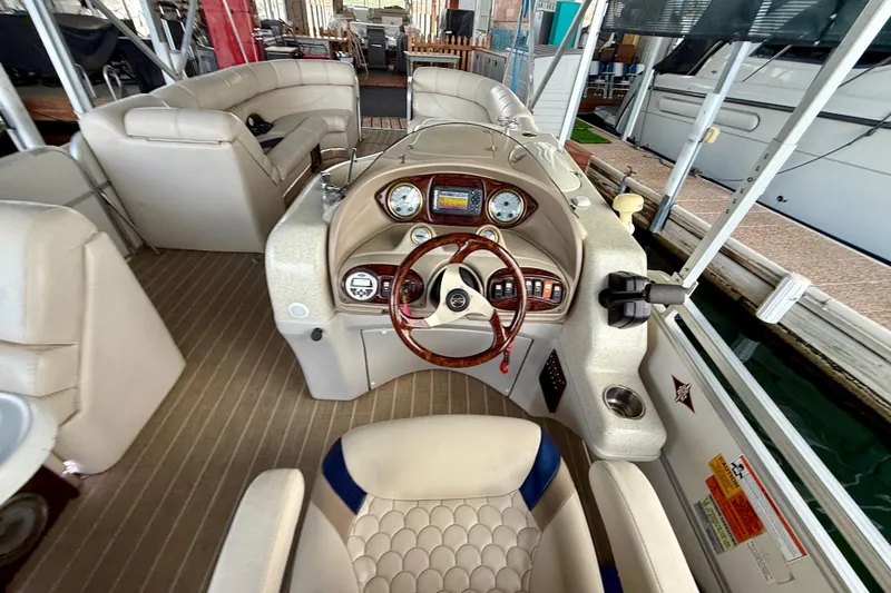Slide: The Image of 2007 South Bay 925CR TT I/O boat interior with steering wheel and seating. - 11