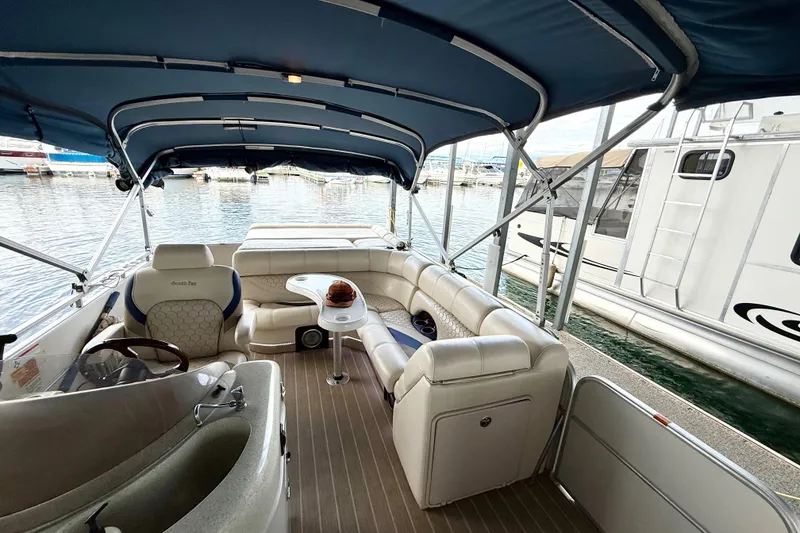 Slide: The Image of 2007 South Bay 925CR TT I/O pontoon boat interior with seating and canopy. - 12