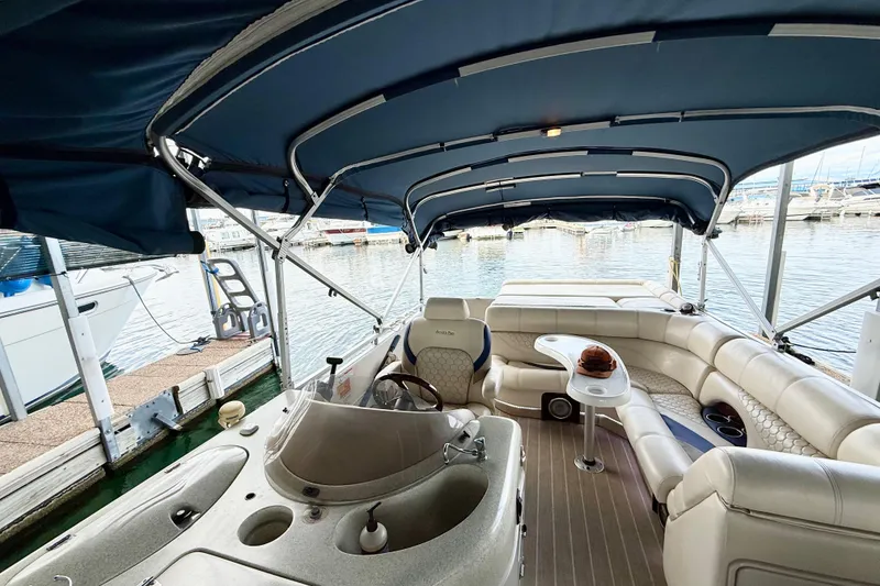 Slide: The Image of 2007 South Bay 925CR TT I/O pontoon boat interior with seating and canopy. - 14