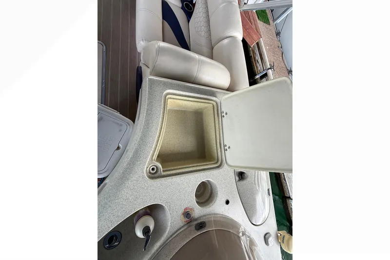 Slide: The Image of 2007 South Bay 925CR TT I/O boat interior with seating and storage compartment. - 16