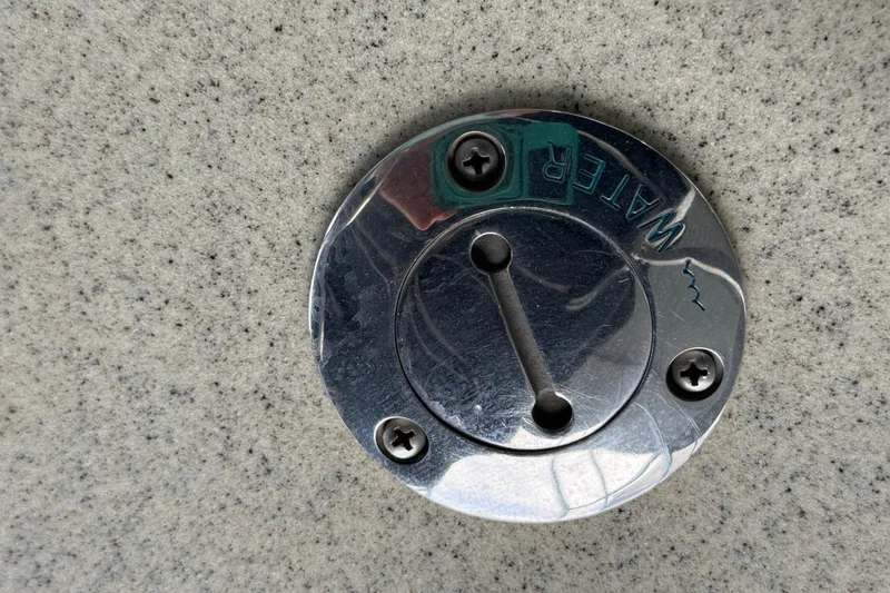 Slide: The Image of Water inlet cap on 2007 South Bay 925CR TT I/O boat deck. - 17