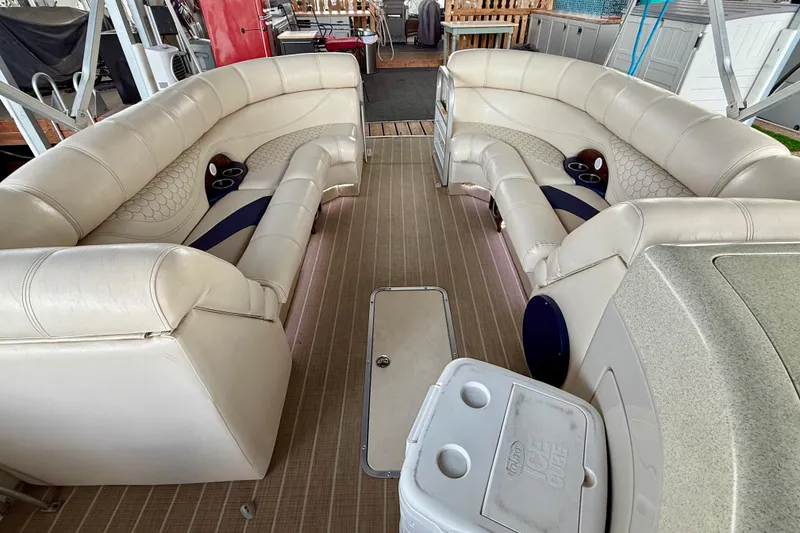Slide: The Image of 2007 South Bay 925CR TT I/O boat interior with beige seating and cup holders. - 18