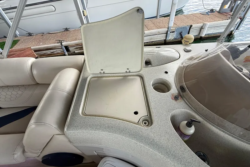 Slide: The Image of 2007 South Bay 925CR TT I/O boat interior with open storage compartment and seating. - 19