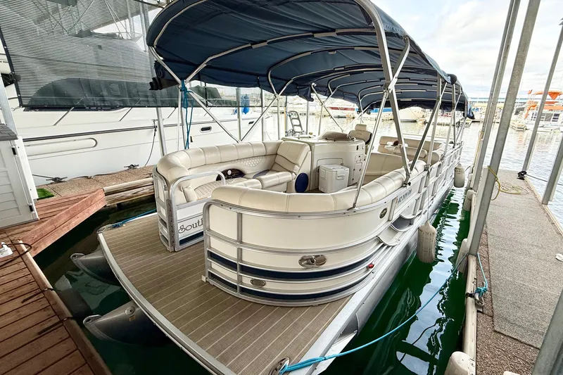 Slide: The Image of 2007 South Bay 925CR TT I/O pontoon boat docked at marina with canopy. - 2