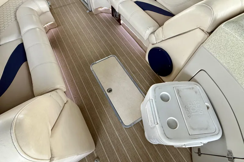 Slide: The Image of 2007 South Bay 925CR TT I/O boat interior with beige seating and cooler. - 20