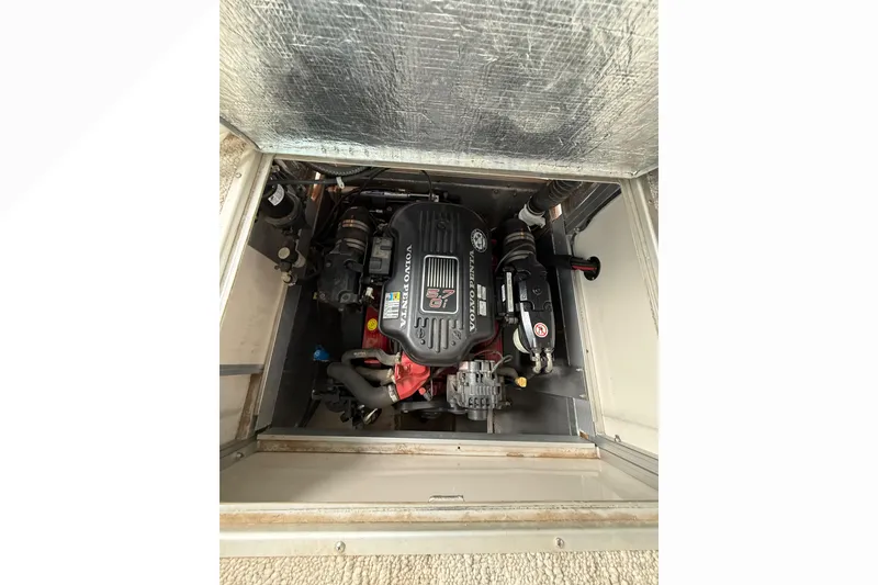 Slide: The Image of Engine compartment of 2007 South Bay 925CR TT I/O boat, featuring Volvo Penta engine. - 23
