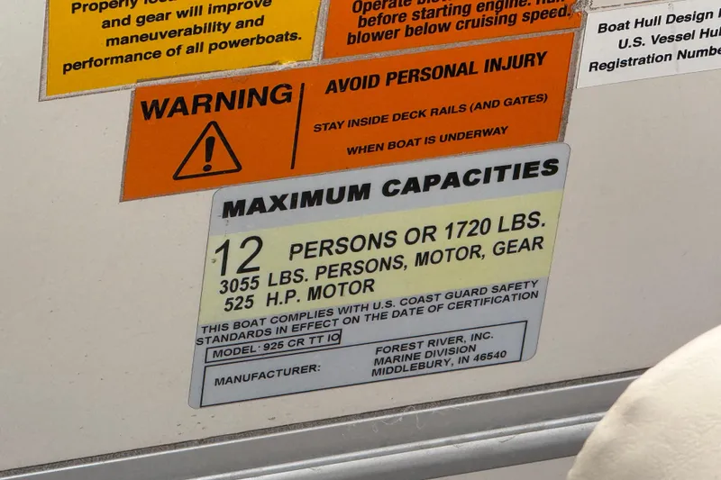 Slide: The Image of Warning and capacity labels on a 2007 South Bay 925CR TT I/O boat. - 28