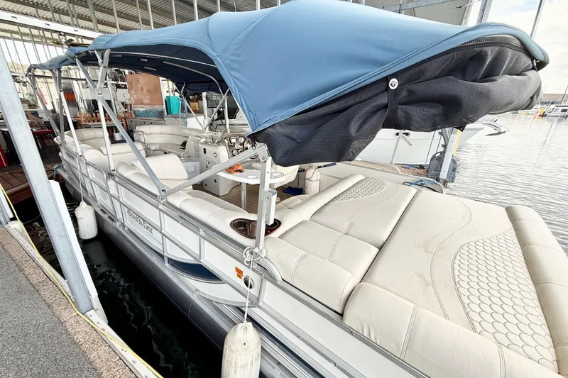Slide: The Image of 2007 South Bay 925CR TT I/O pontoon boat with blue canopy docked in marina. - 6
