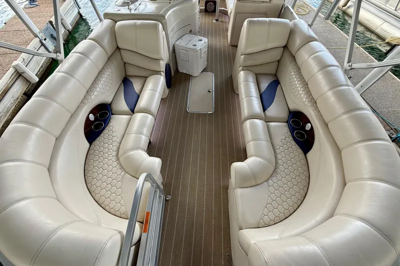 Slide: The Image of Luxurious interior of 2007 South Bay 925CR TT I/O boat with plush seating and cup holders. - 7