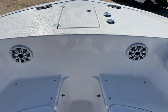 Slide: The Image of 2018 Tidewater 252 CC Adventure boat deck with speakers and storage hatch. - 11