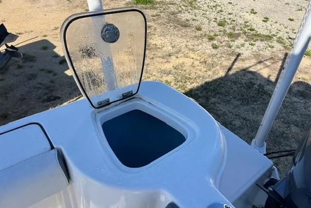 Slide: The Image of Open hatch on 2018 Tidewater 252 CC Adventure boat, showing storage compartment. - 3