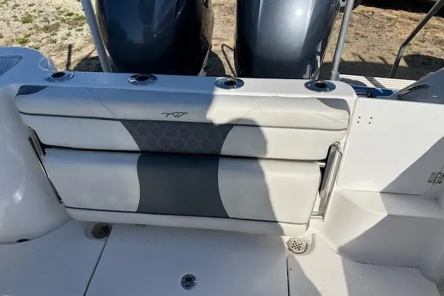 Slide: The Image of 2018 Tidewater 252 CC Adventure boat with dual engines and cushioned seating. - 4