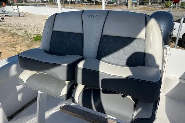 Slide: The Image of 2018 Tidewater 252 CC Adventure boat seats with gray and black upholstery. - 7