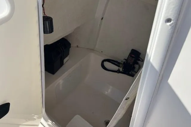 Slide: The Image of 2018 Tidewater 252 CC Adventure boat interior storage compartment. - 8