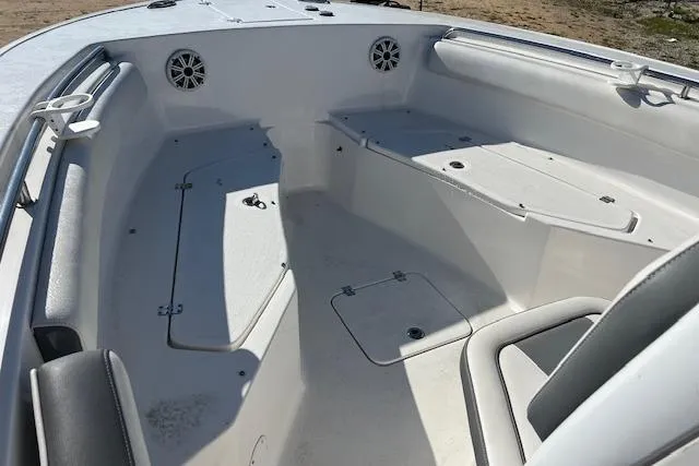 Slide: The Image of 2018 Tidewater 252 CC Adventure boat interior with seating and storage compartments. - 9