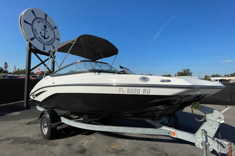 The Image of 2019 Yamaha Boats SX195 on trailer, displayed for sale under cloudy sky. - 0