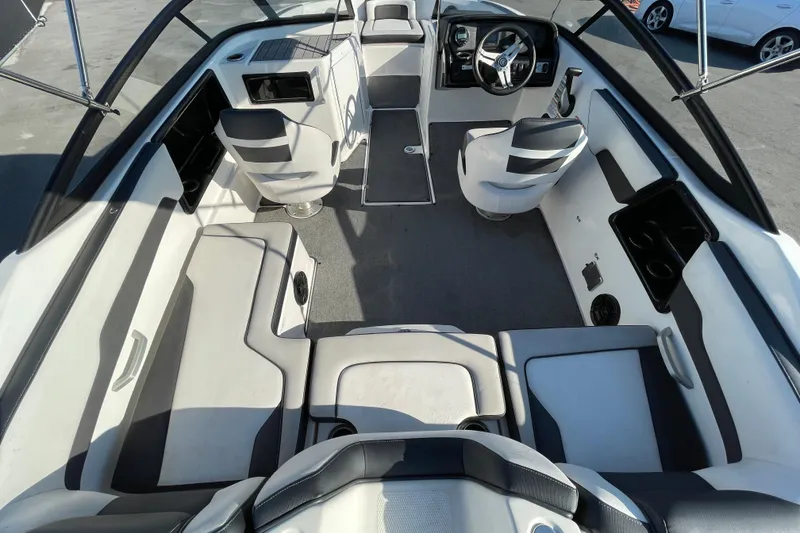 Slide: The Image of Open storage compartment on 2019 Yamaha Boats SX195, showcasing interior details. - 16