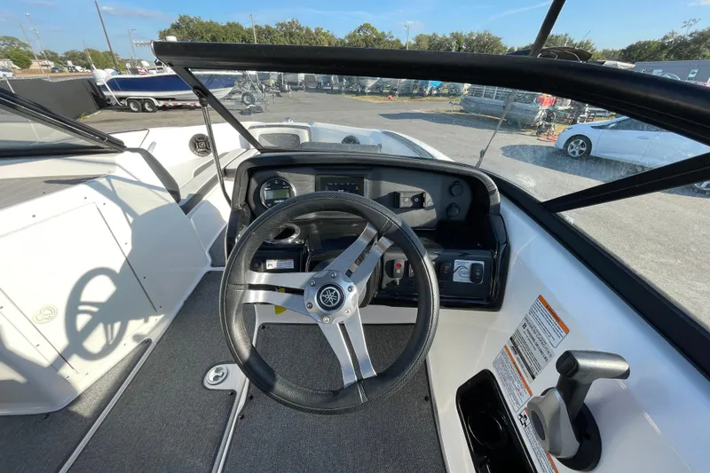 Slide: The Image of 2019 Yamaha Boats SX195 interior with seating and steering wheel, showcasing modern design. - 21