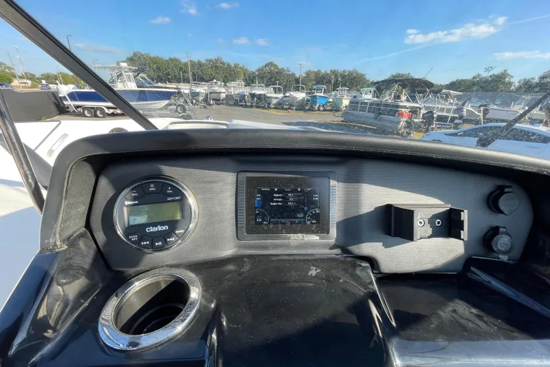 Slide: The Image of 2019 Yamaha Boats SX195 interior with steering wheel, seating, and dashboard controls. - 24