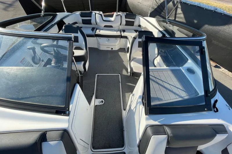 Slide: The Image of 2019 Yamaha Boats SX195 interior with seating and storage compartments. - 36