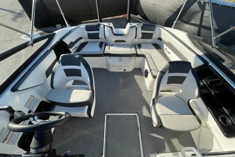 Slide: The Image of 2019 Yamaha Boats SX195 interior with seating and storage compartment. - 41
