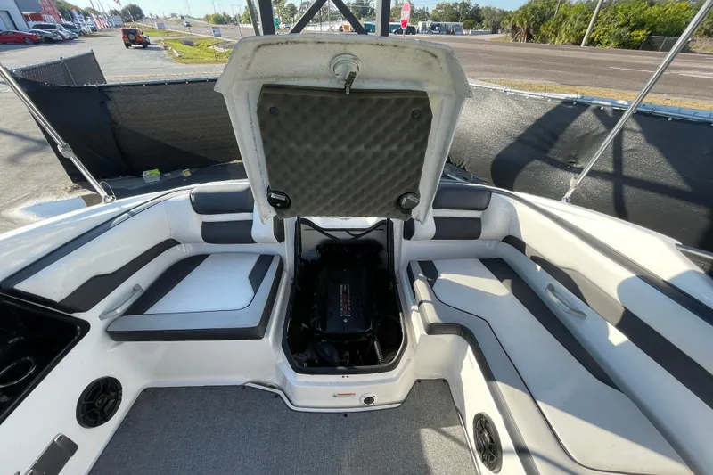 Slide: The Image of 2019 Yamaha Boats SX195 interior with open storage compartment and speaker. - 46