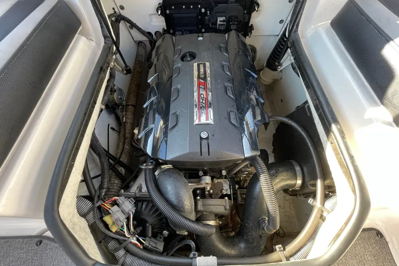 Slide: The Image of 2019 Yamaha Boats SX195 interior seating, featuring sleek white and black upholstery design. - 48