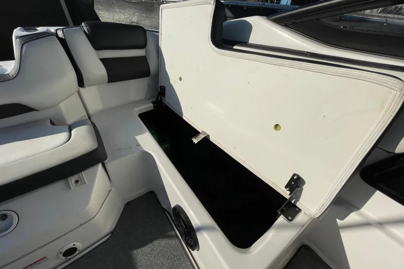 Slide: The Image of 2019 Yamaha Boats SX195 interior seating and storage compartment. - 49