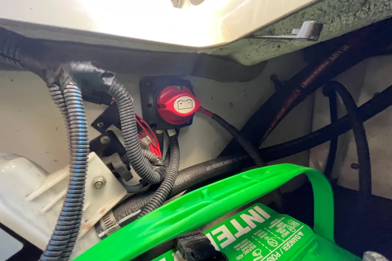 Slide: The Image of 2019 Yamaha Boats SX195 interior storage compartment with speaker and cushioned seating. - 52