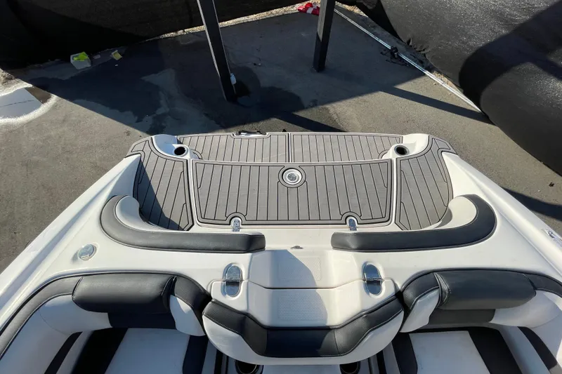 Slide: The Image of 2019 Yamaha Boats SX195 interior carpeted storage compartment. - 53