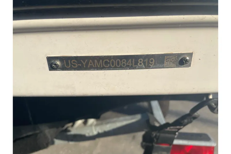 Slide: The Image of 2019 Yamaha Boats SX195 interior with cushioned seating and cup holders. - 54