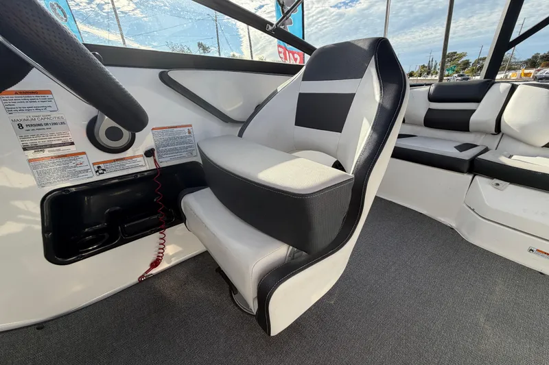 Slide: The Image of 2019 Yamaha Boats SX195 interior with steering wheel and seating. - 66