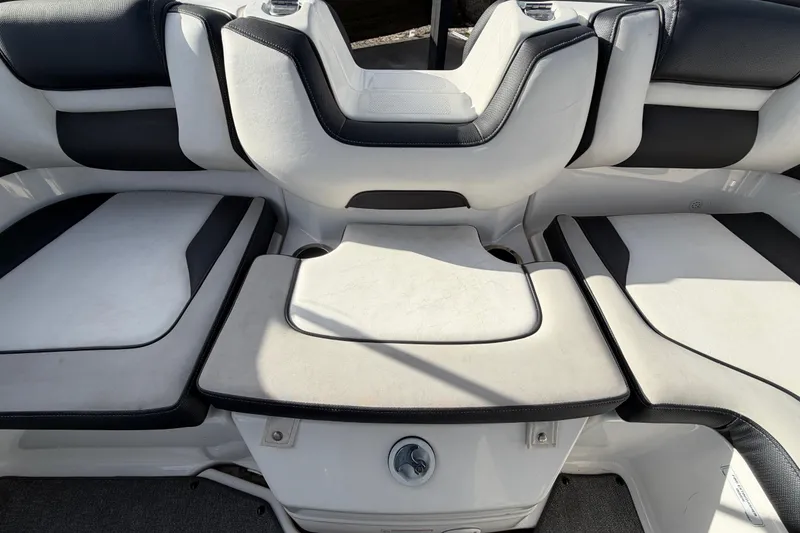Slide: The Image of 2019 Yamaha Boats SX195 interior seating with white and black upholstery. - 72