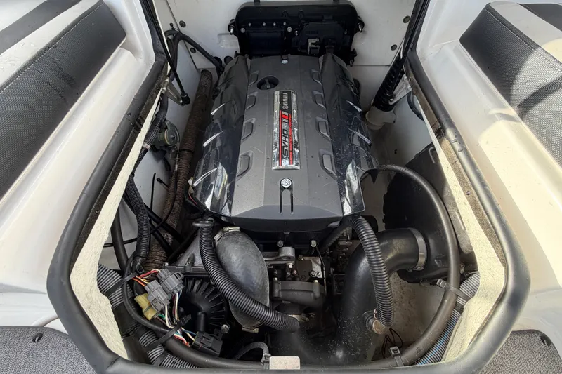 Slide: The Image of 2019 Yamaha Boats SX195 engine compartment with visible components and wiring. - 76