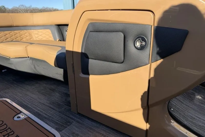 Slide: The Image of 2026 Godfrey Monaco 235 SFLC iMPACT boat interior with tan and black seating. - 10