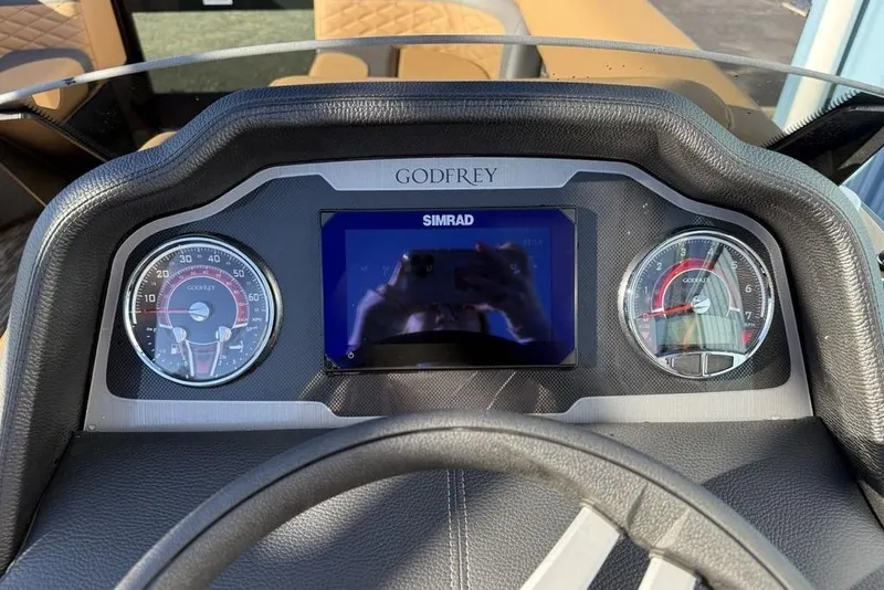 Slide: The Image of Dashboard of 2026 Godfrey Monaco 235 SFLC iMPACT with Simrad display and gauges. - 13