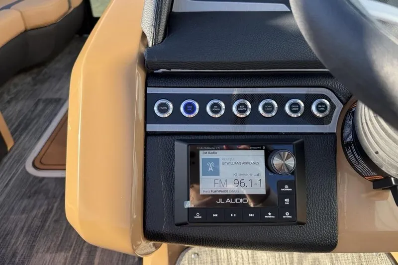 Slide: The Image of 2026 Godfrey Monaco 235 SFLC iMPACT dashboard with JL Audio system and control buttons. - 16