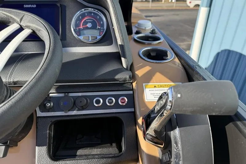 Slide: The Image of Dashboard of 2026 Godfrey Monaco 235 SFLC iMPACT boat with steering wheel and controls. - 17