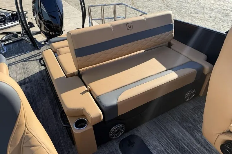 Slide: The Image of Luxurious seating on 2026 Godfrey Monaco 235 SFLC iMPACT boat, featuring tan and gray upholstery. - 19