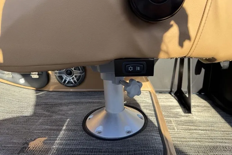 Slide: The Image of 2026 Godfrey Monaco 235 SFLC iMPACT boat seat adjustment mechanism and speaker detail. - 23