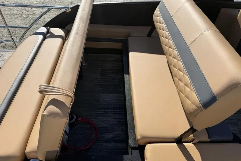 Slide: The Image of 2026 Godfrey Monaco 235 SFLC iMPACT boat interior with tan seating and quilted design. - 25