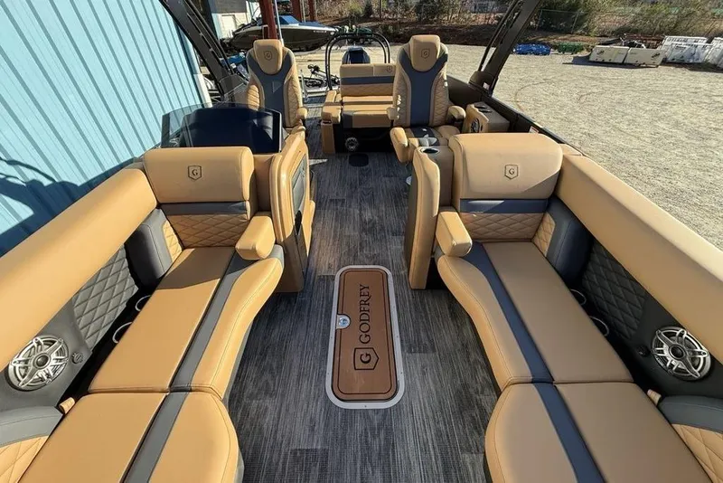 Slide: The Image of Luxurious interior of 2026 Godfrey Monaco 235 SFLC iMPACT pontoon boat with tan seating. - 31
