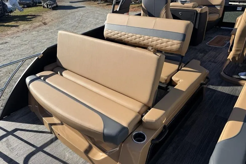 Slide: The Image of 2026 Godfrey Monaco 235 SFLC iMPACT boat with tan seating and cup holders. - 32