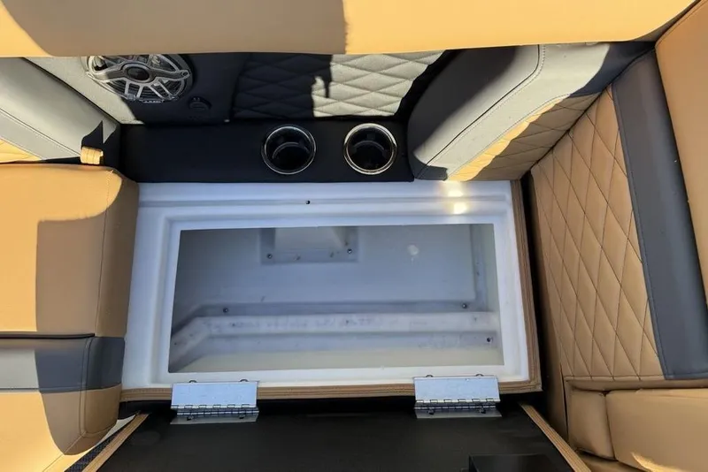 Slide: The Image of 2026 Godfrey Monaco 235 SFLC iMPACT boat interior with storage compartment and cup holders. - 38