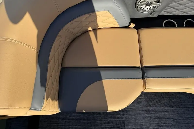 Slide: The Image of Luxurious seating on 2026 Godfrey Monaco 235 SFLC iMPACT boat, featuring tan and gray upholstery. - 4