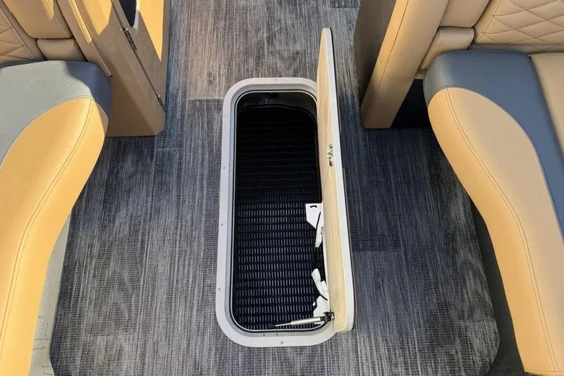 Slide: The Image of 2026 Godfrey Monaco 235 SFLC iMPACT boat interior with open storage compartment. - 9