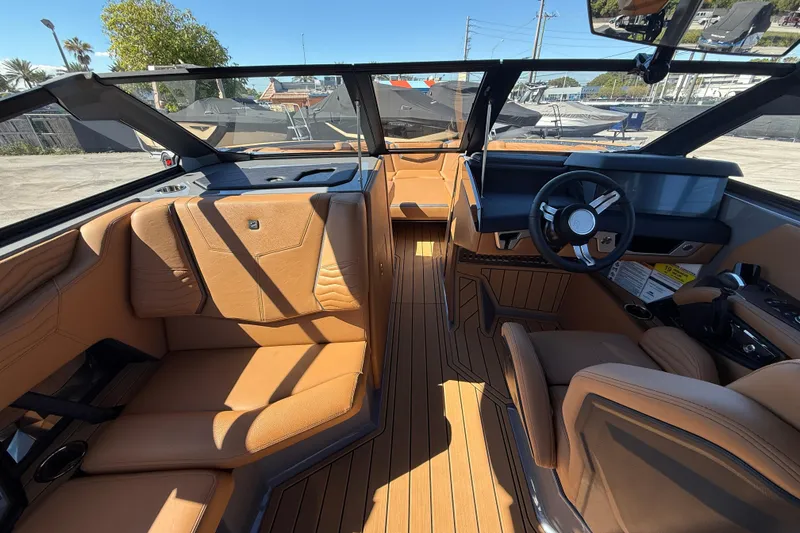 Slide: The Image of Luxurious interior of 2026 Nautique Super Air Nautique G25 Coastal Edition boat. - 10